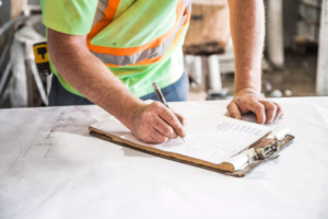 a builder checking the design